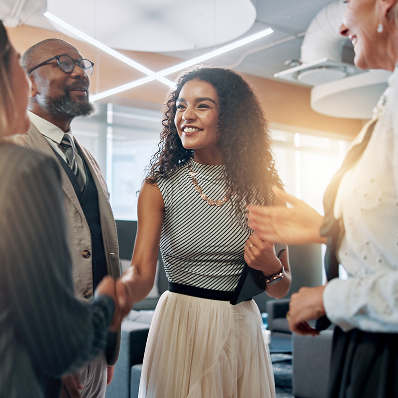 Meeting, handshake and business people in office for partnership, agreement and thank you. Corporate, teamwork and happy men and women shaking hands for collaboration, success and b2b networking